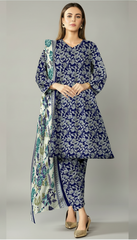 Woman wearing a blue floral outfit with a matching dupatta in an indoor setting.